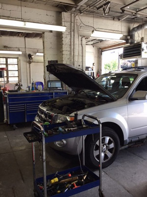 Picture of a ford explorer being repaired