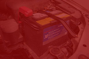 Picture of a car battery being replaced