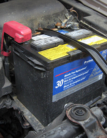 Picture of a car battery being replaced