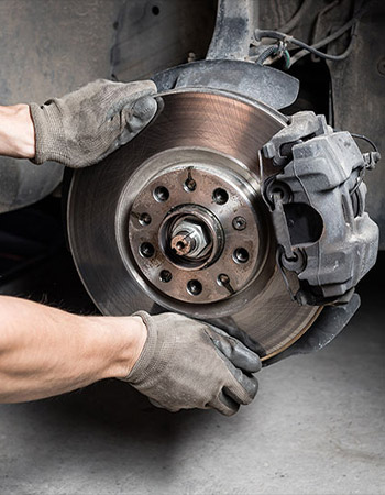Picture of a tire's brake being replaced
